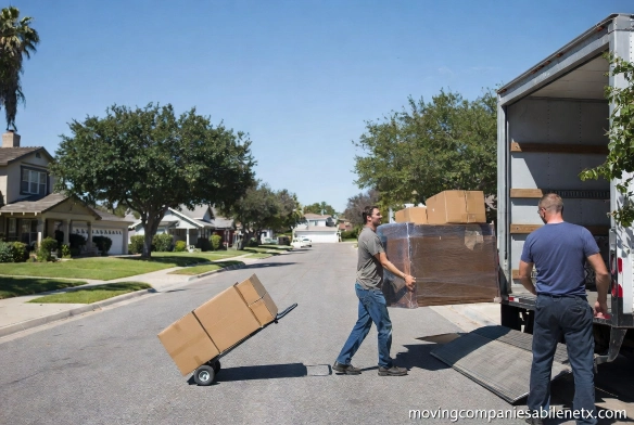 A professional moving truck driving through a South Abilene neighborhood with a "No Surcharge" promotional badge.